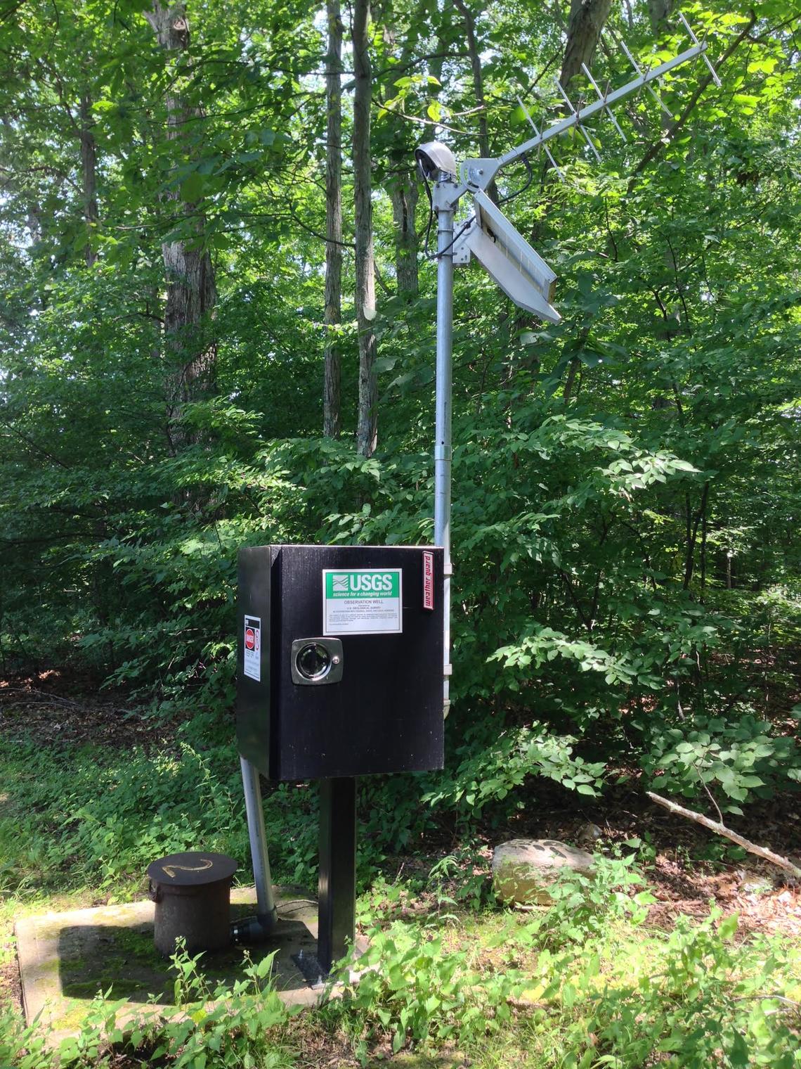 A photo of a groundwater site with equipment that allows data to be transmitted.